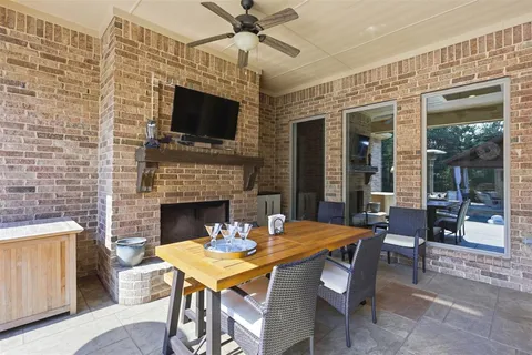 a dining room with furniture window and a fireplace