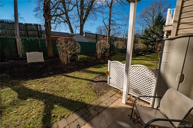 a view of a chair and tables in the patio