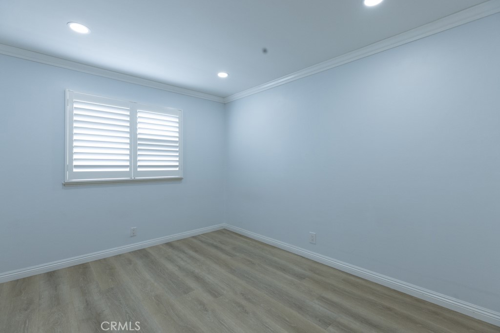 4821 Cathy Avenue Cypress, CA 90630 - Photo 11 of 21 an empty room with wooden floor and windows