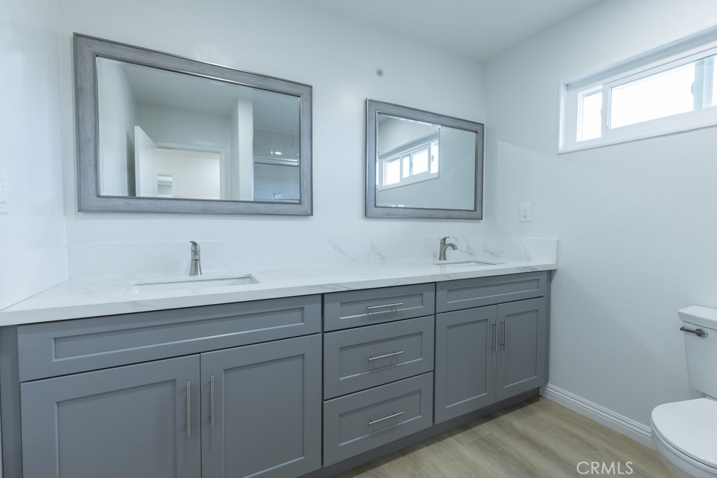 4821 Cathy Avenue Cypress, CA 90630 - Photo 15 of 21 a bathroom with 2 sink and a toilet