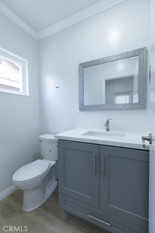4821 Cathy Avenue Cypress, CA 90630 - Photo 21 of 21 a bathroom with a toilet a sink and mirror
