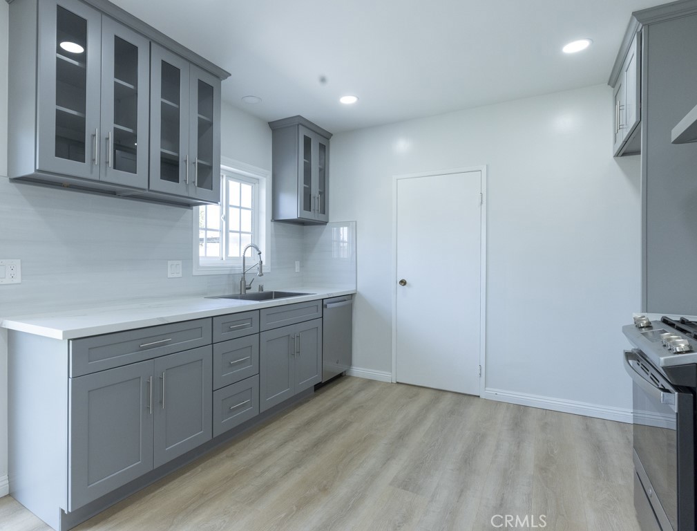 4821 Cathy Avenue Cypress, CA 90630 - Photo 6 of 21 a kitchen with a sink cabinets and appliances