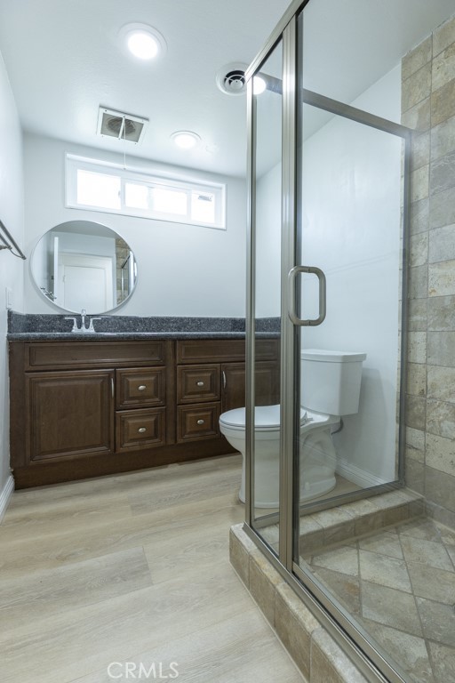 4821 Cathy Avenue Cypress, CA 90630 - Photo 10 of 21 a bathroom with a sink and a mirror