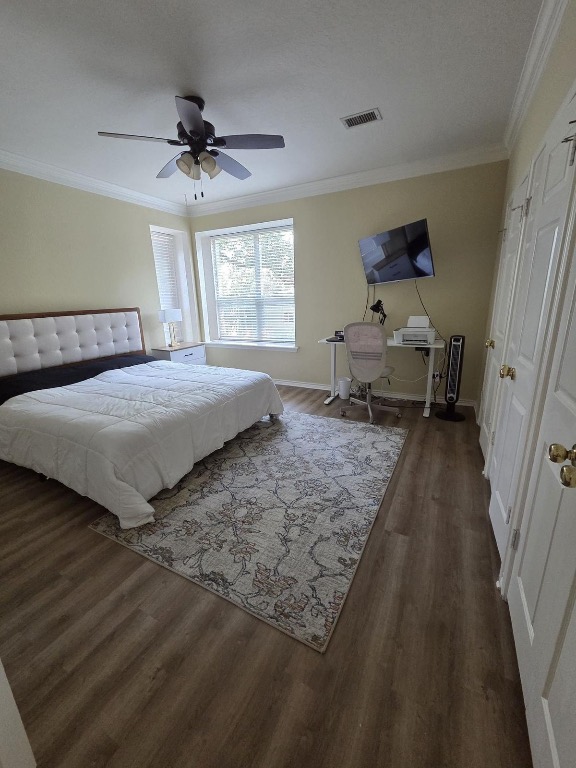 1203 Cardinal Lane Round Rock, TX 78681 - Photo 11 of 17 a bedroom with a bed and a chandelier