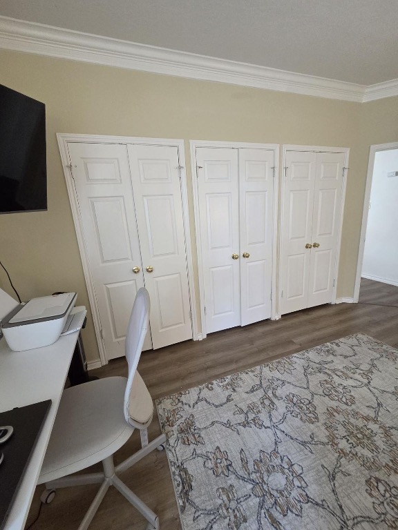 1203 Cardinal Lane Round Rock, TX 78681 - Photo 15 of 17 a view of an empty room with wooden floor and a bathroom