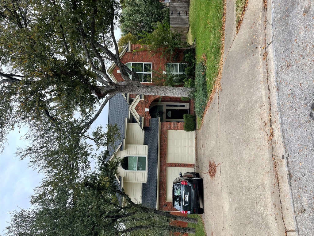 1203 Cardinal Lane Round Rock, TX 78681 - Photo 2 of 17 a view of a house with a outdoor space