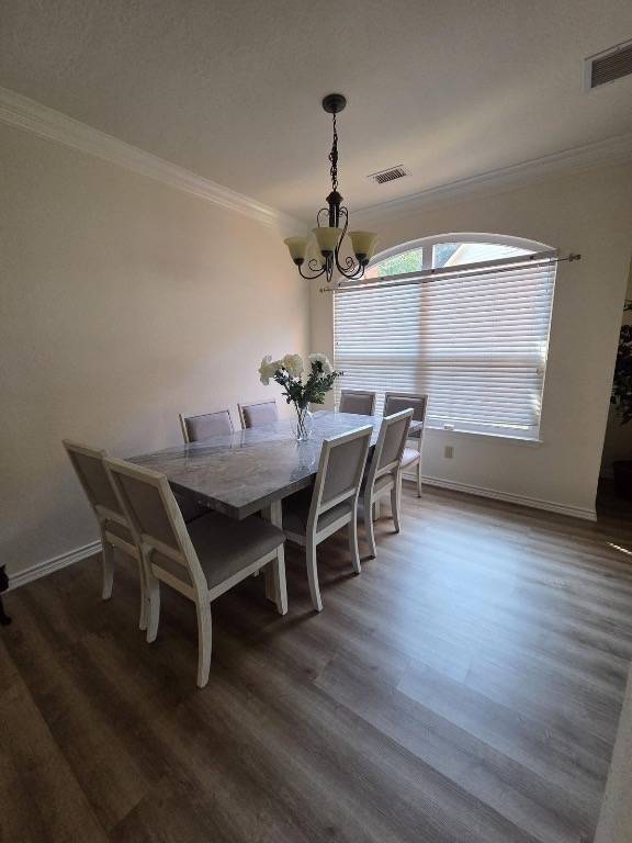 1203 Cardinal Lane Round Rock, TX 78681 - Photo 7 of 17 a dining room with furniture and wooden floor