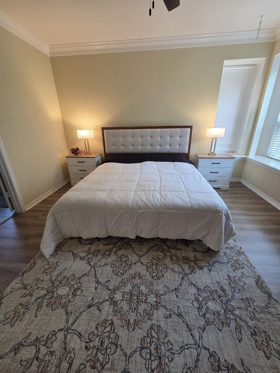 1203 Cardinal Lane Round Rock, TX 78681 - Photo 10 of 17 a bedroom with a bed and wooden floor