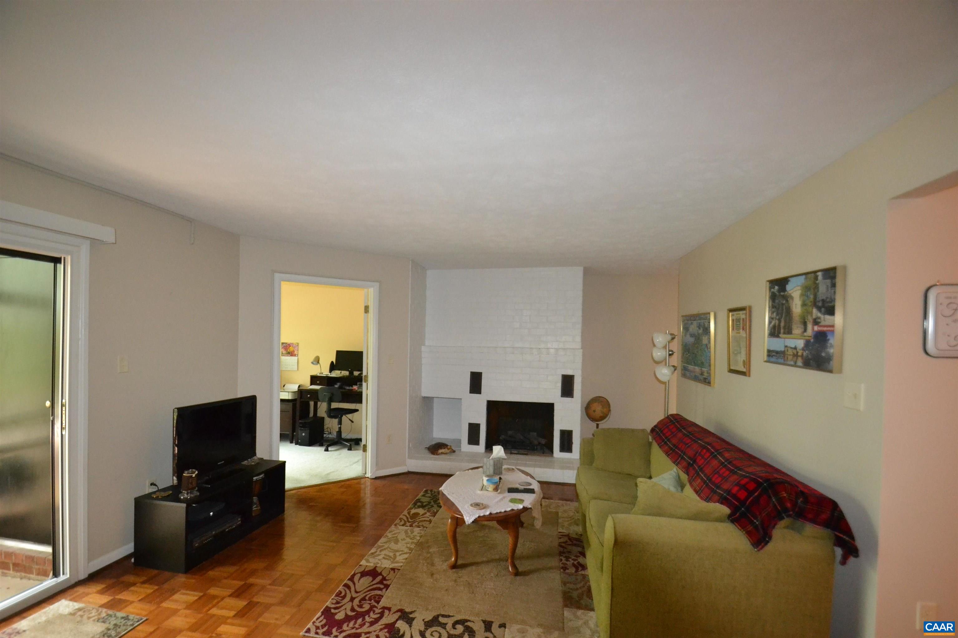 116 Turtle Creek Road, Unit 2 Charlottesville, VA 22901 - Photo 15 of 39 a living room with furniture and a flat screen tv