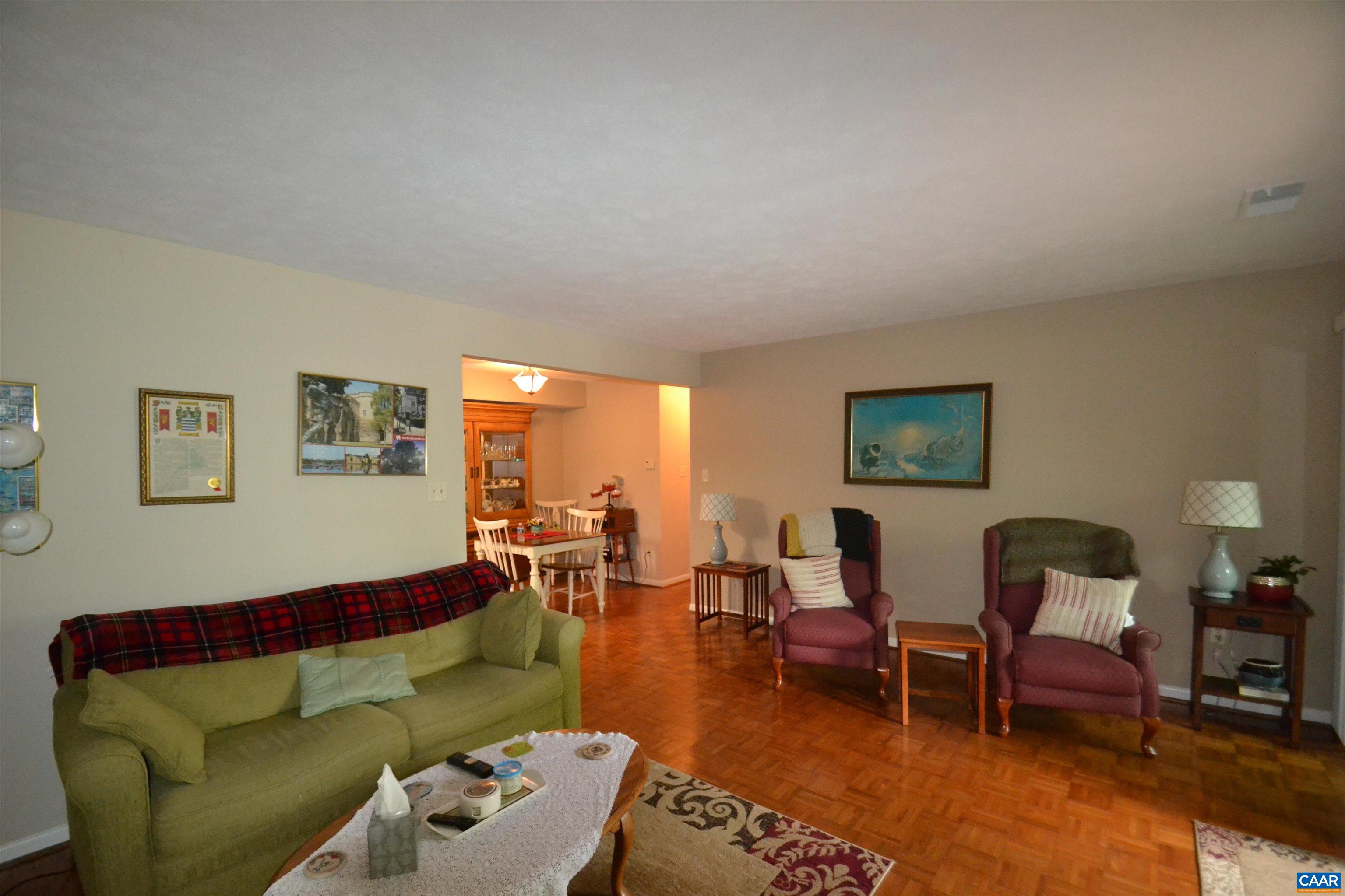 116 Turtle Creek Road, Unit 2 Charlottesville, VA 22901 - Photo 18 of 39 a living room with furniture and a wooden floor