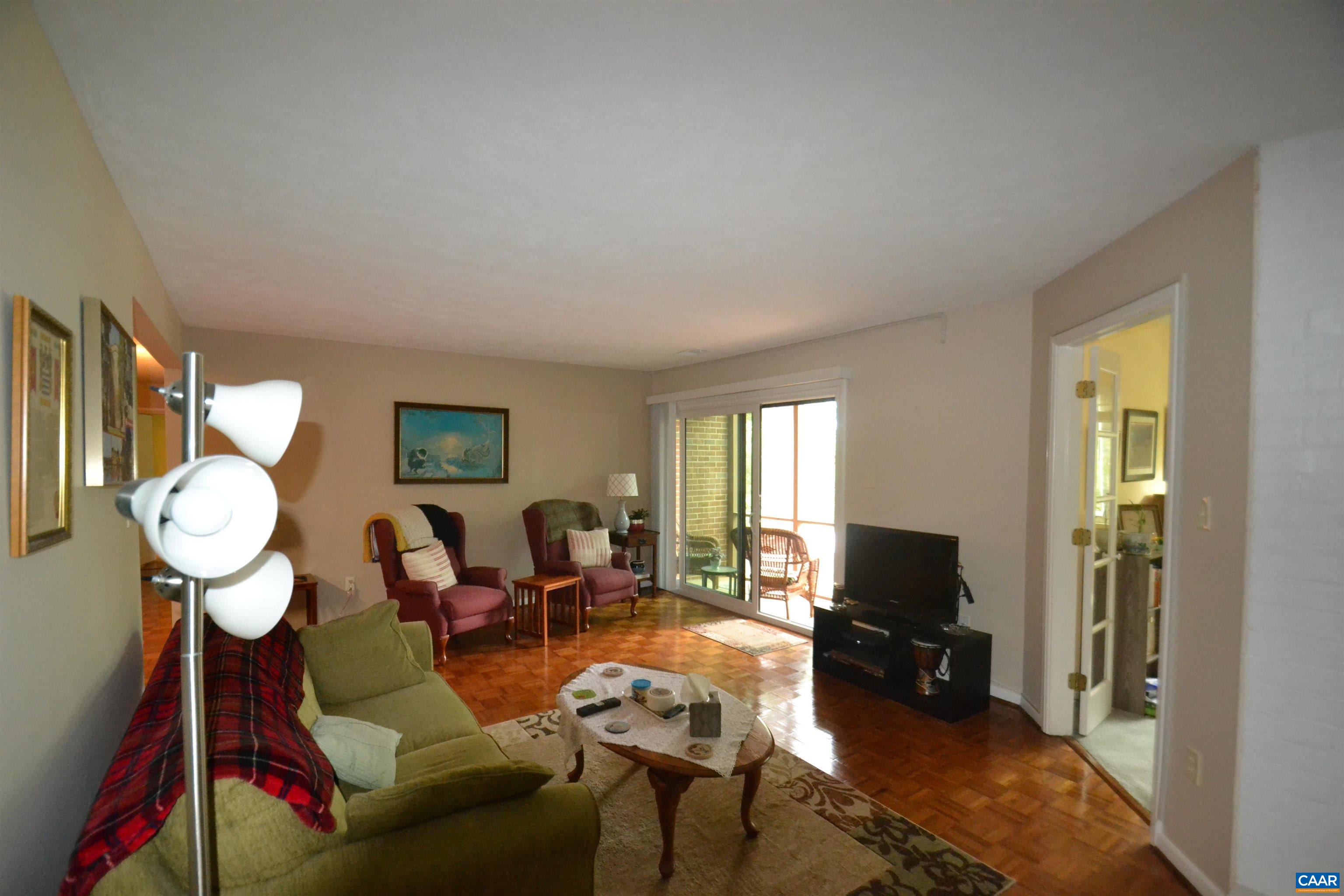 116 Turtle Creek Road, Unit 2 Charlottesville, VA 22901 - Photo 20 of 39 a living room with furniture a large window and flat screen tv