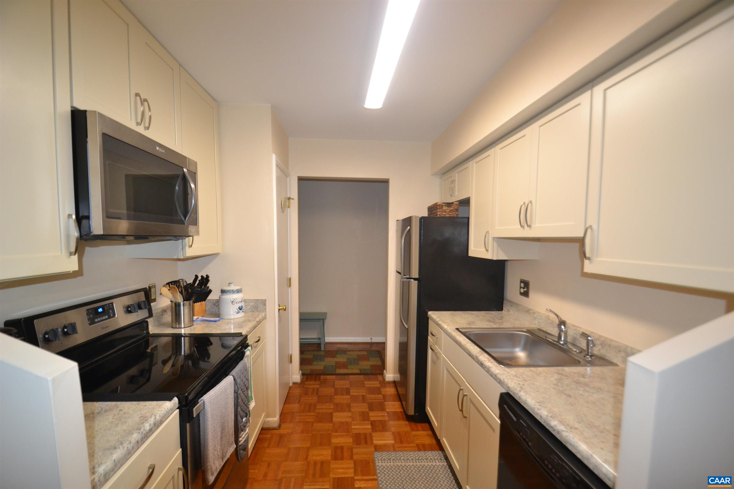 116 Turtle Creek Road, Unit 2 Charlottesville, VA 22901 - Photo 2 of 39 a kitchen with a sink stove top oven and refrigerator