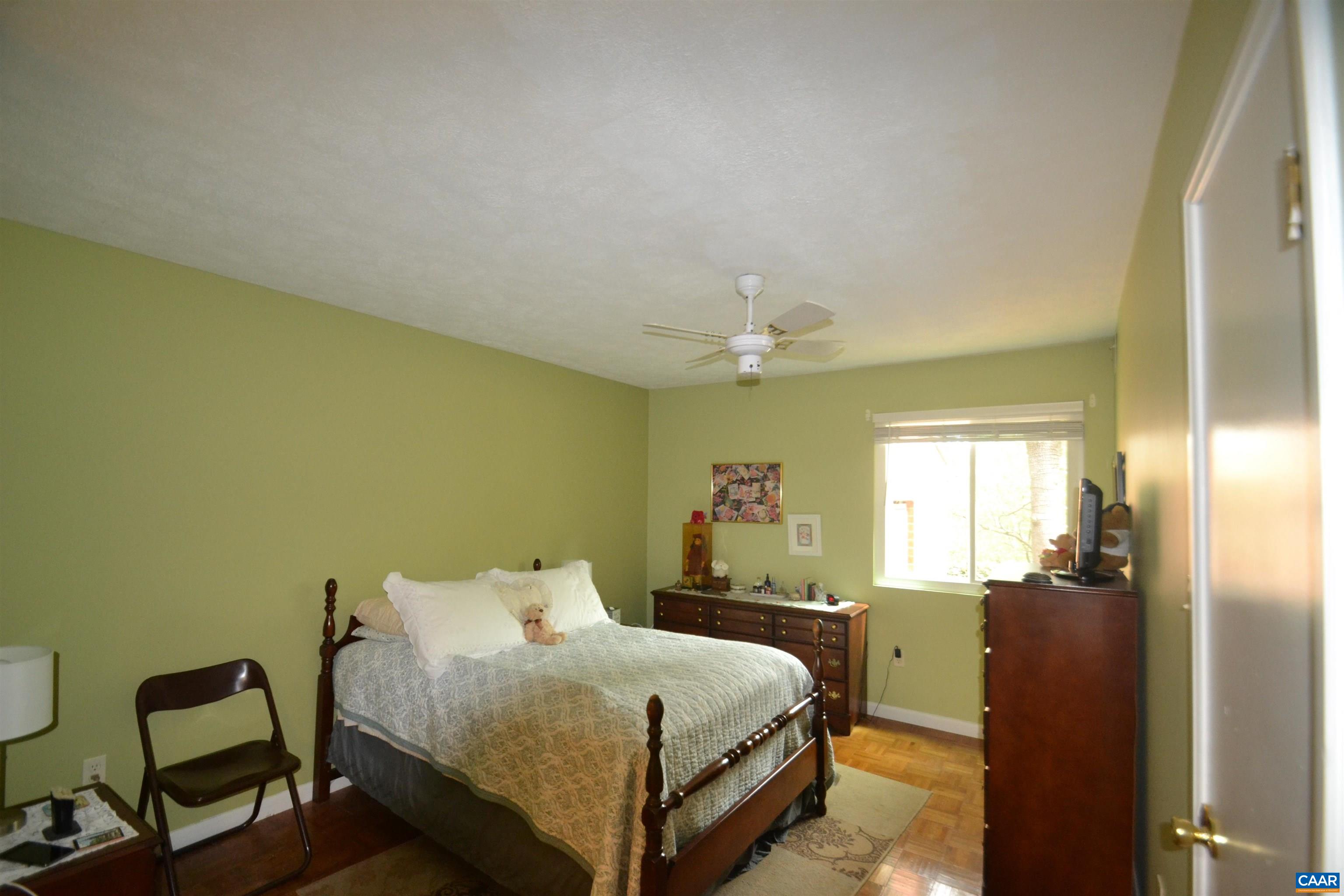 116 Turtle Creek Road, Unit 2 Charlottesville, VA 22901 - Photo 25 of 39 a spacious bedroom with a bed and wooden floor
