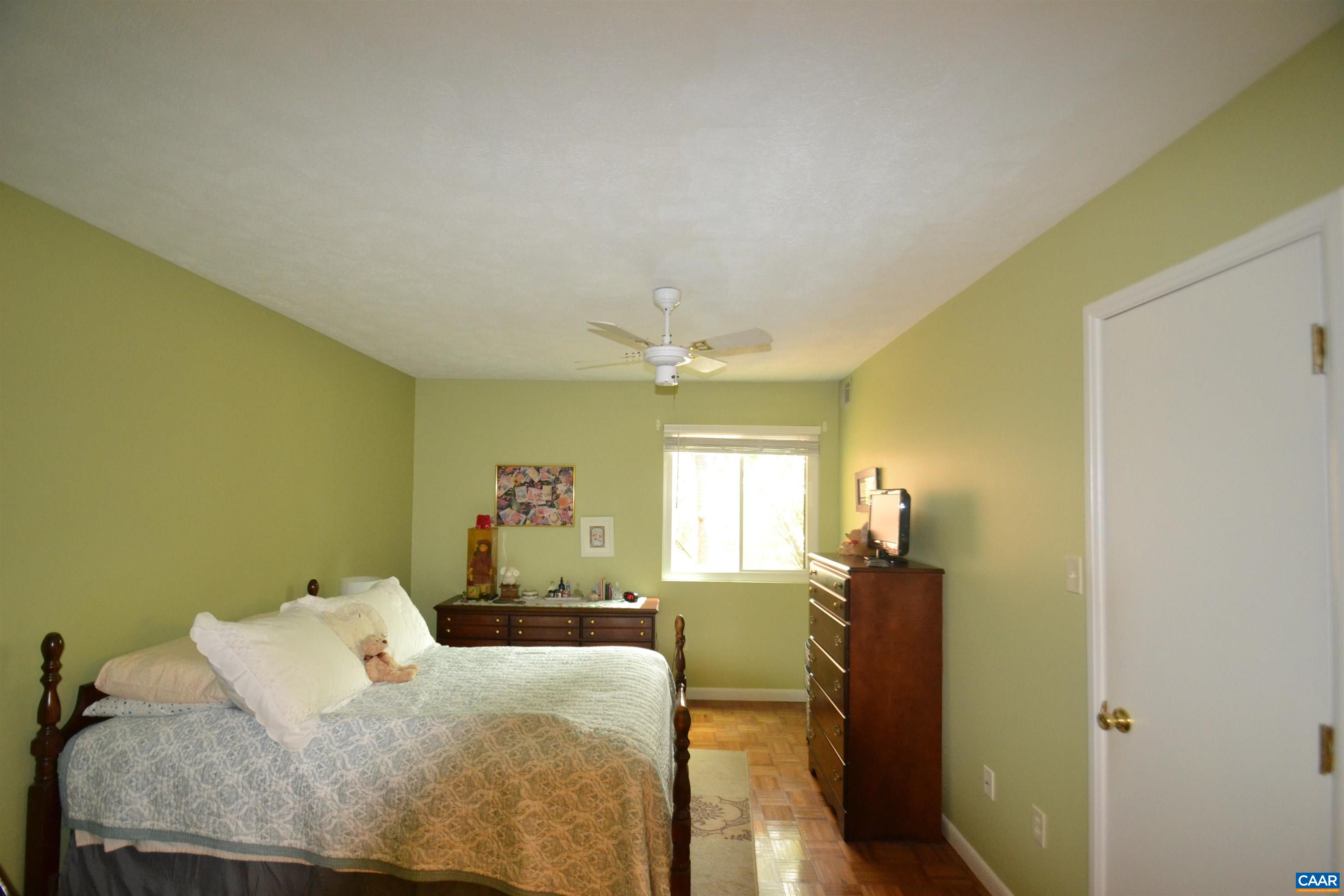 116 Turtle Creek Road, Unit 2 Charlottesville, VA 22901 - Photo 26 of 39 a bedroom with a bed window and couch