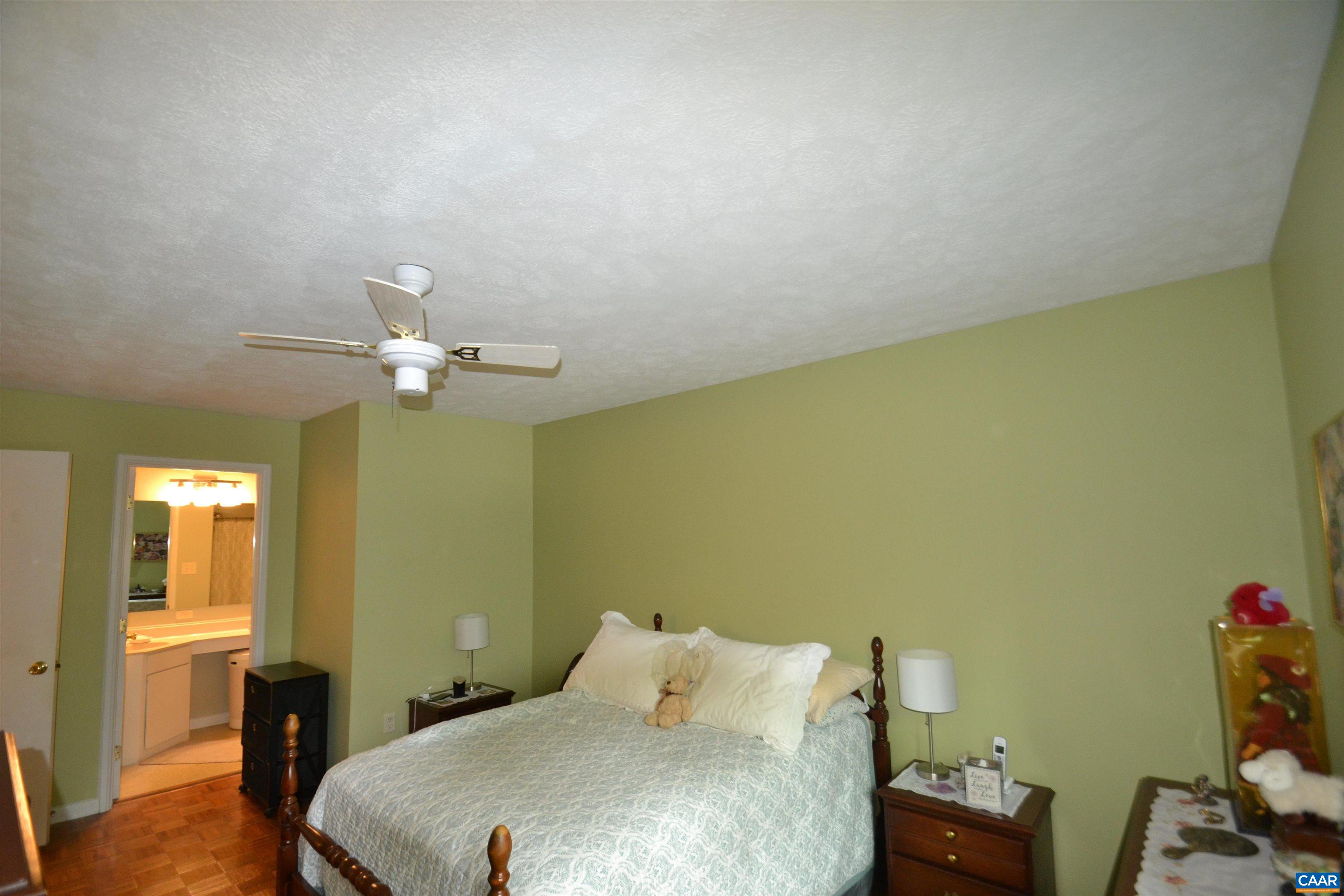 116 Turtle Creek Road, Unit 2 Charlottesville, VA 22901 - Photo 28 of 39 a bedroom with a bed and a table