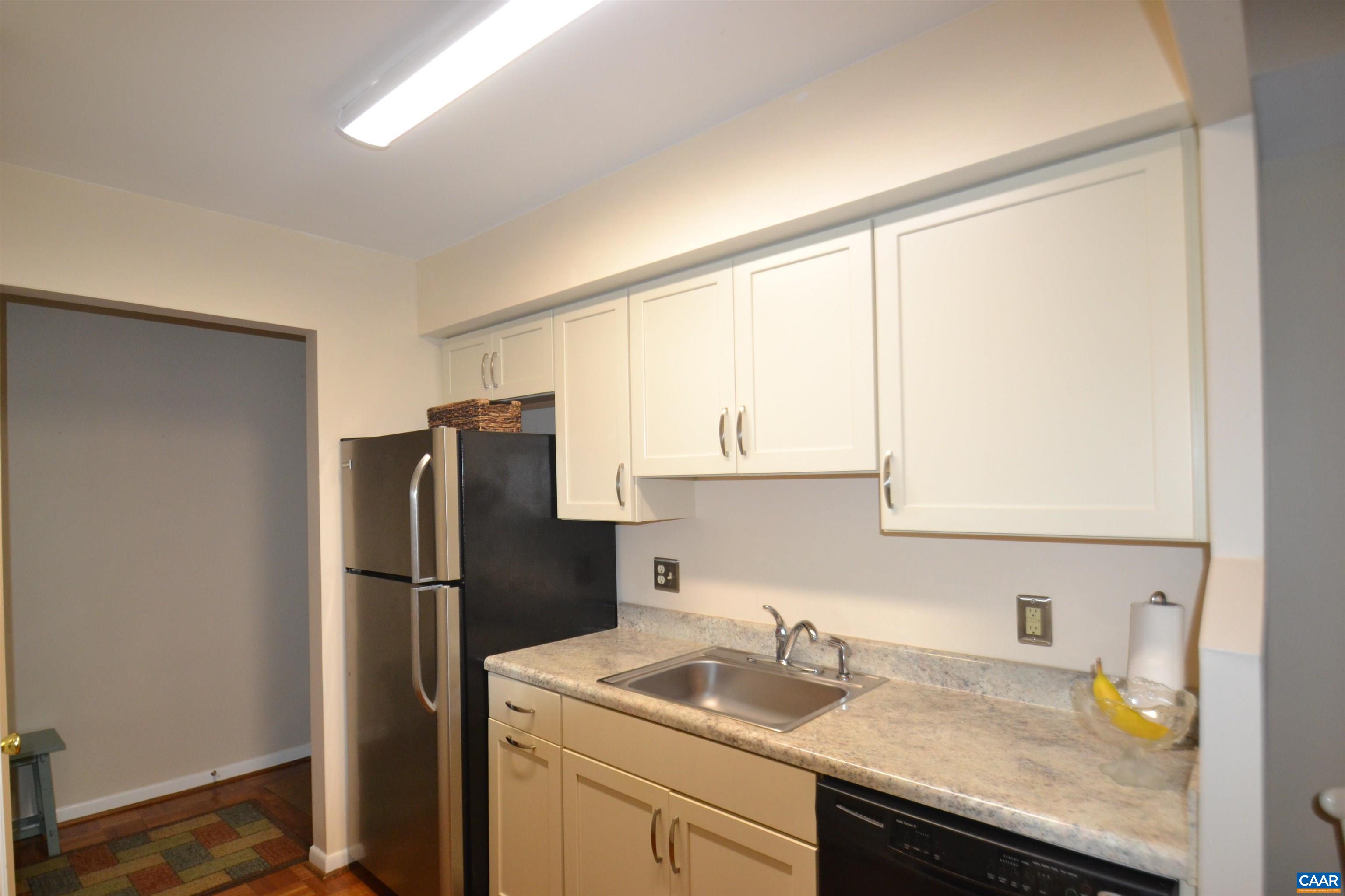 116 Turtle Creek Road, Unit 2 Charlottesville, VA 22901 - Photo 3 of 39 a kitchen with a refrigerator sink and cabinets