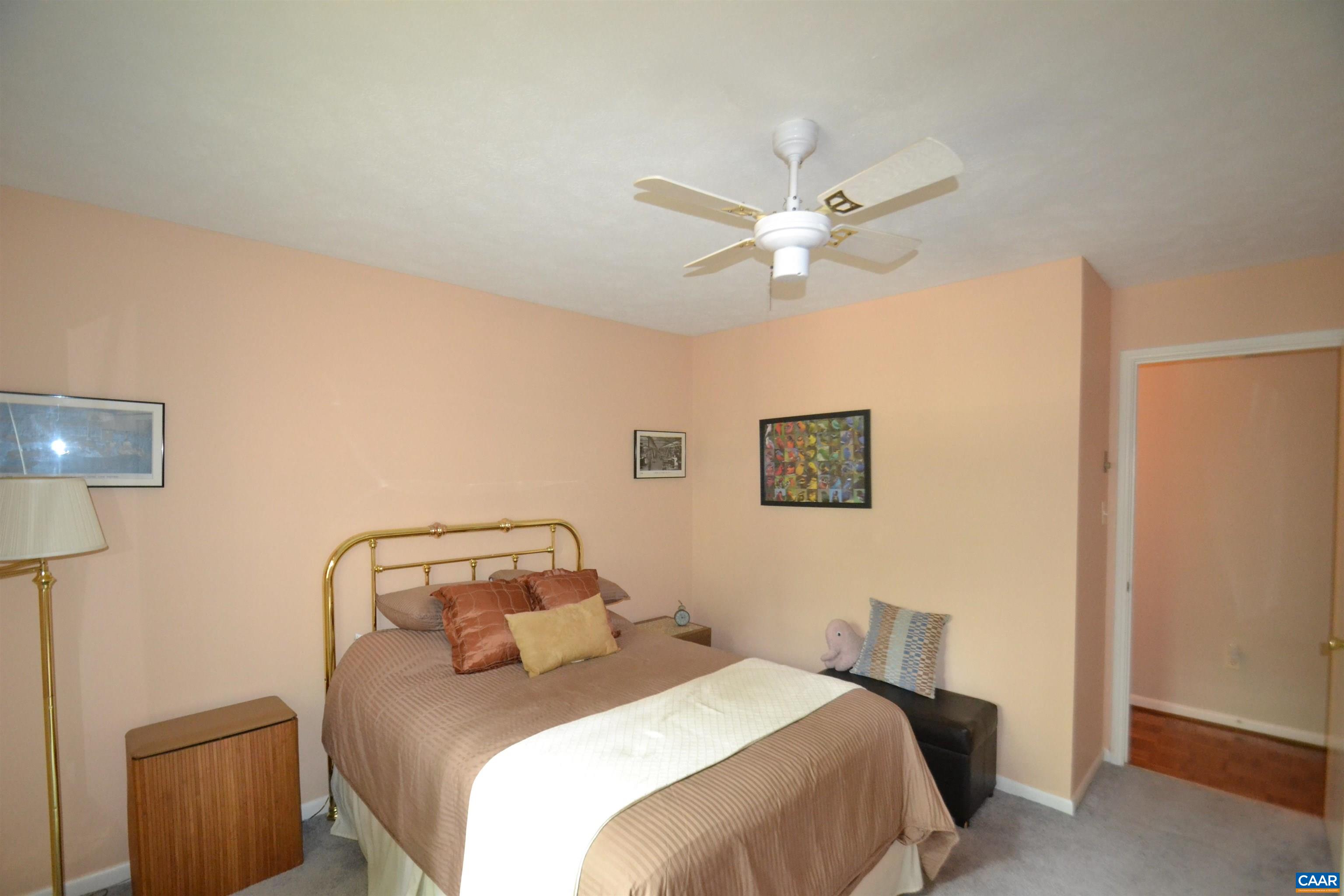 116 Turtle Creek Road, Unit 2 Charlottesville, VA 22901 - Photo 32 of 39 a bedroom with a bed and a ceiling fan