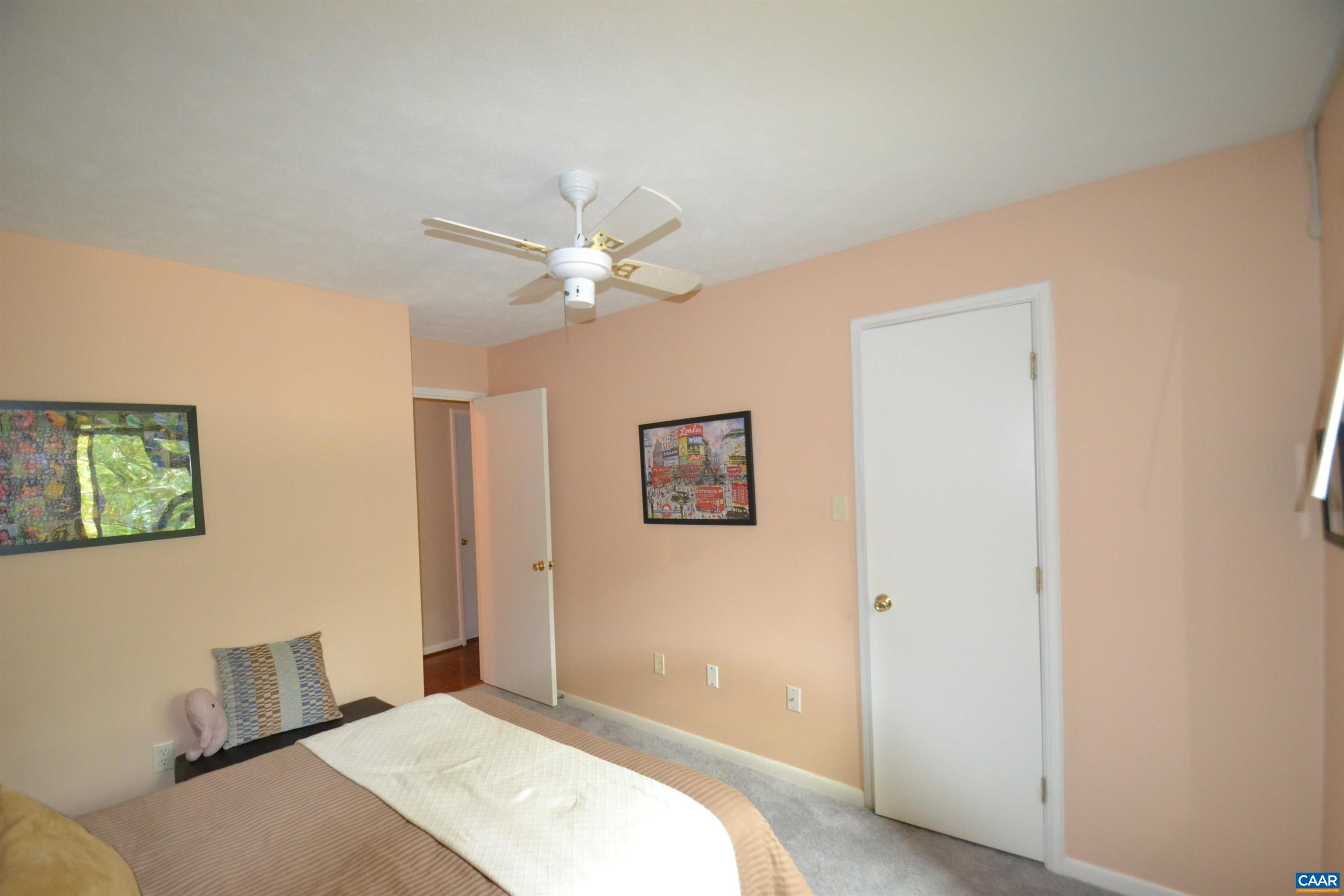 116 Turtle Creek Road, Unit 2 Charlottesville, VA 22901 - Photo 33 of 39 a bedroom with a large bed and a chandelier