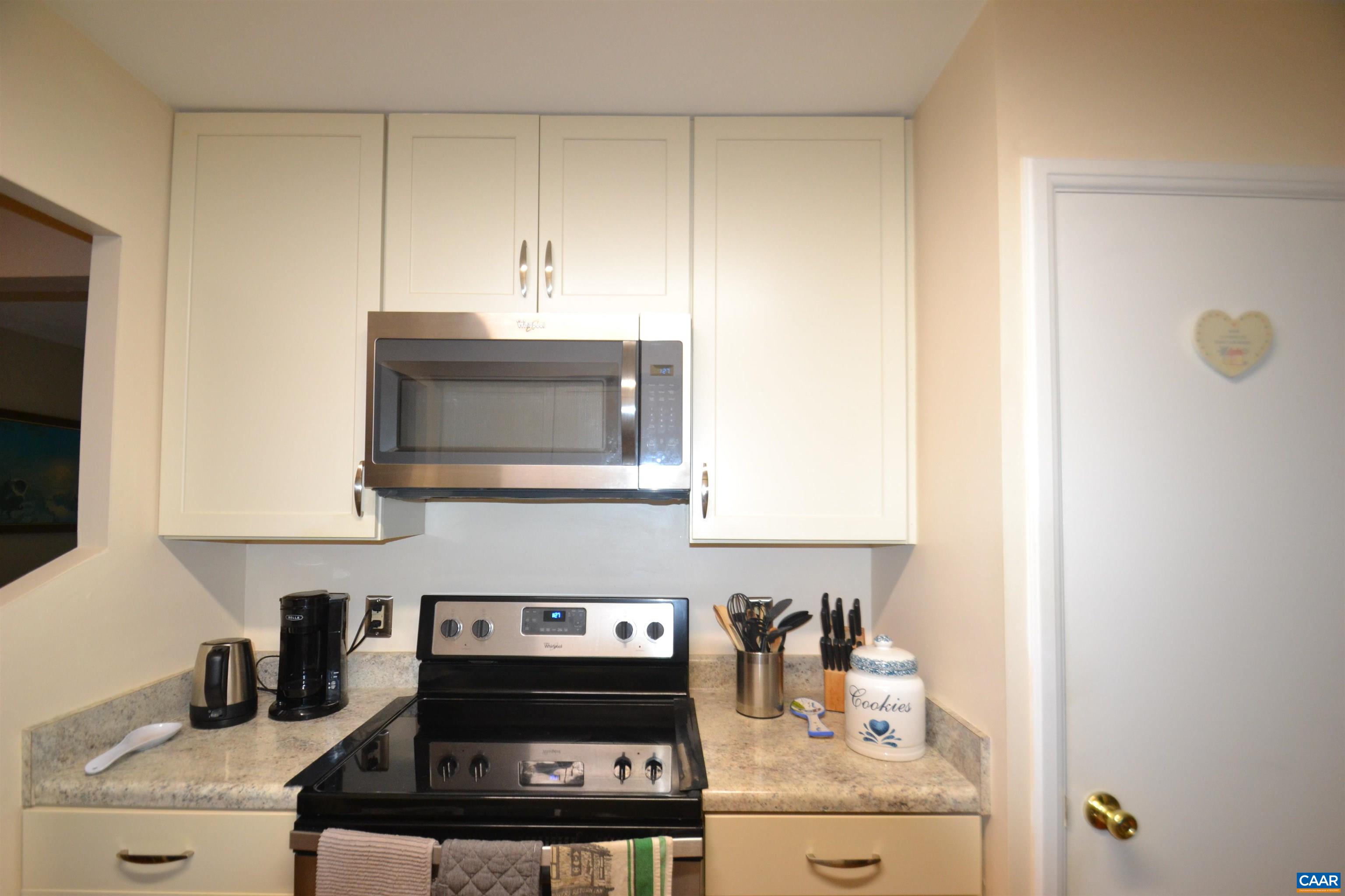 116 Turtle Creek Road, Unit 2 Charlottesville, VA 22901 - Photo 9 of 39 a kitchen with a stove and cabinets