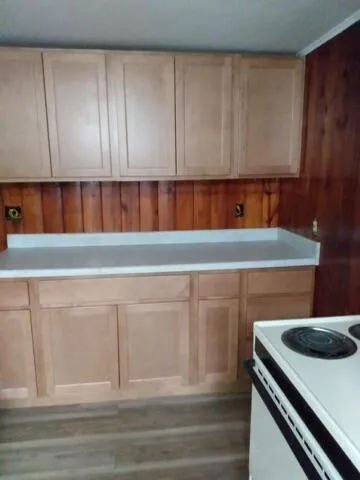 a view of white cabinets and a stove