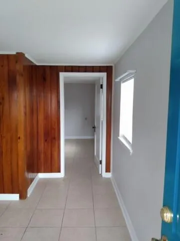 a view of an empty room and window