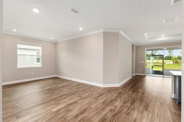 a large kitchen with stainless steel appliances granite countertop a stove and a sink