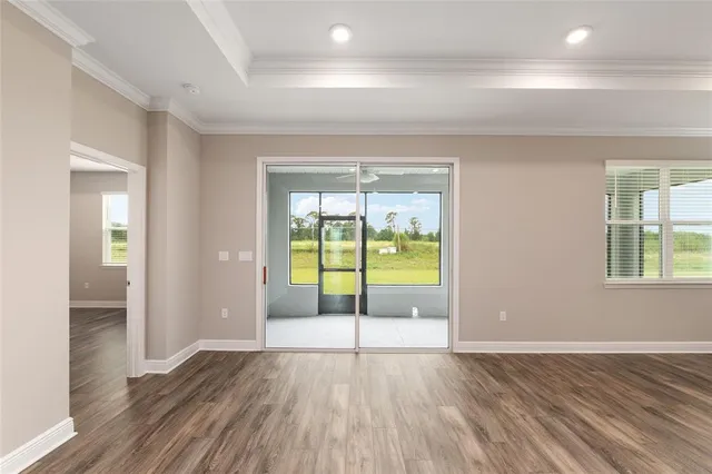 a large kitchen with stainless steel appliances a large counter top a stove and a sink