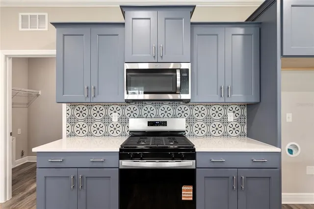 a bathroom with a double vanity sink mirror and toilet