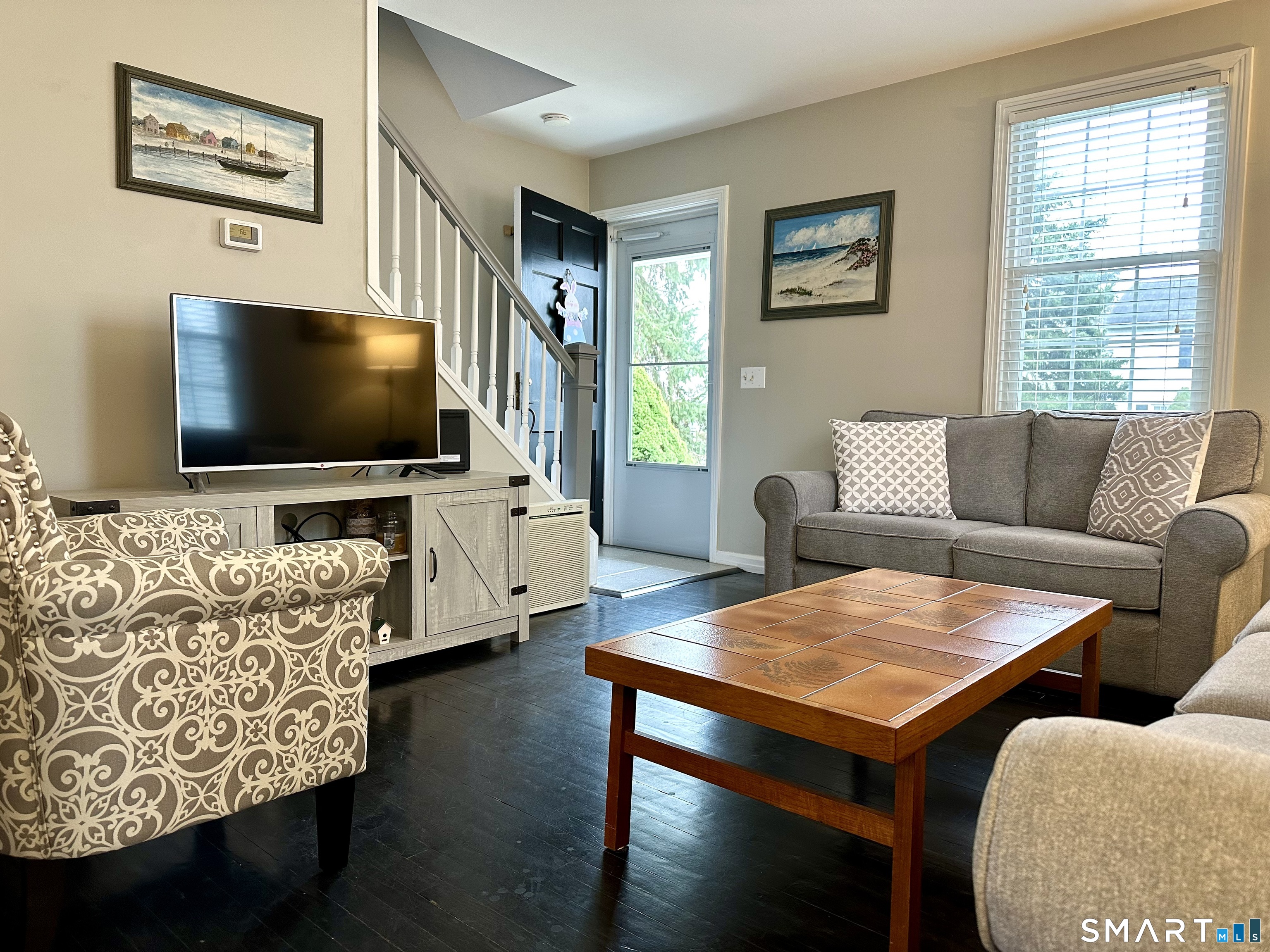 198 Sylvan Knoll Road Stamford, CT 06902 - Photo 3 of 17 a living room with furniture and a flat screen tv