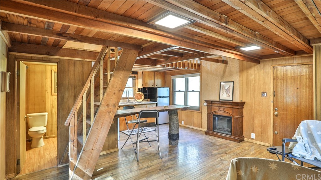 34 Manker Flats Mt Baldy, CA 91759 - Photo 14 of 30 a view of a livingroom with furniture wooden floor and a fireplace