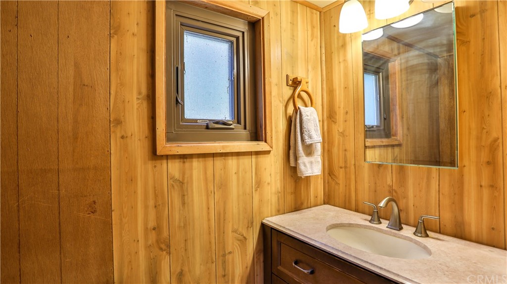 34 Manker Flats Mt Baldy, CA 91759 - Photo 16 of 30 a bathroom with a granite countertop sink and a mirror