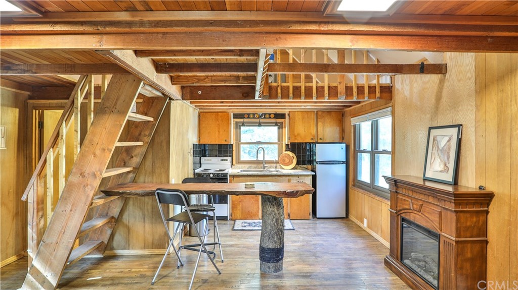 34 Manker Flats Mt Baldy, CA 91759 - Photo 6 of 30 a view of a dining room with furniture window and wooden floor