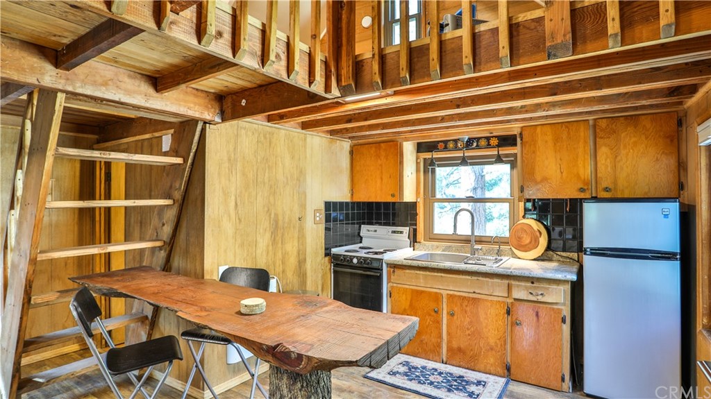 34 Manker Flats Mt Baldy, CA 91759 - Photo 7 of 30 a workspace with stainless steel appliances granite countertop a stove and a refrigerator