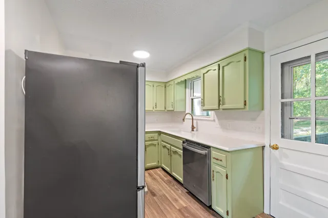 a kitchen with a sink and a window