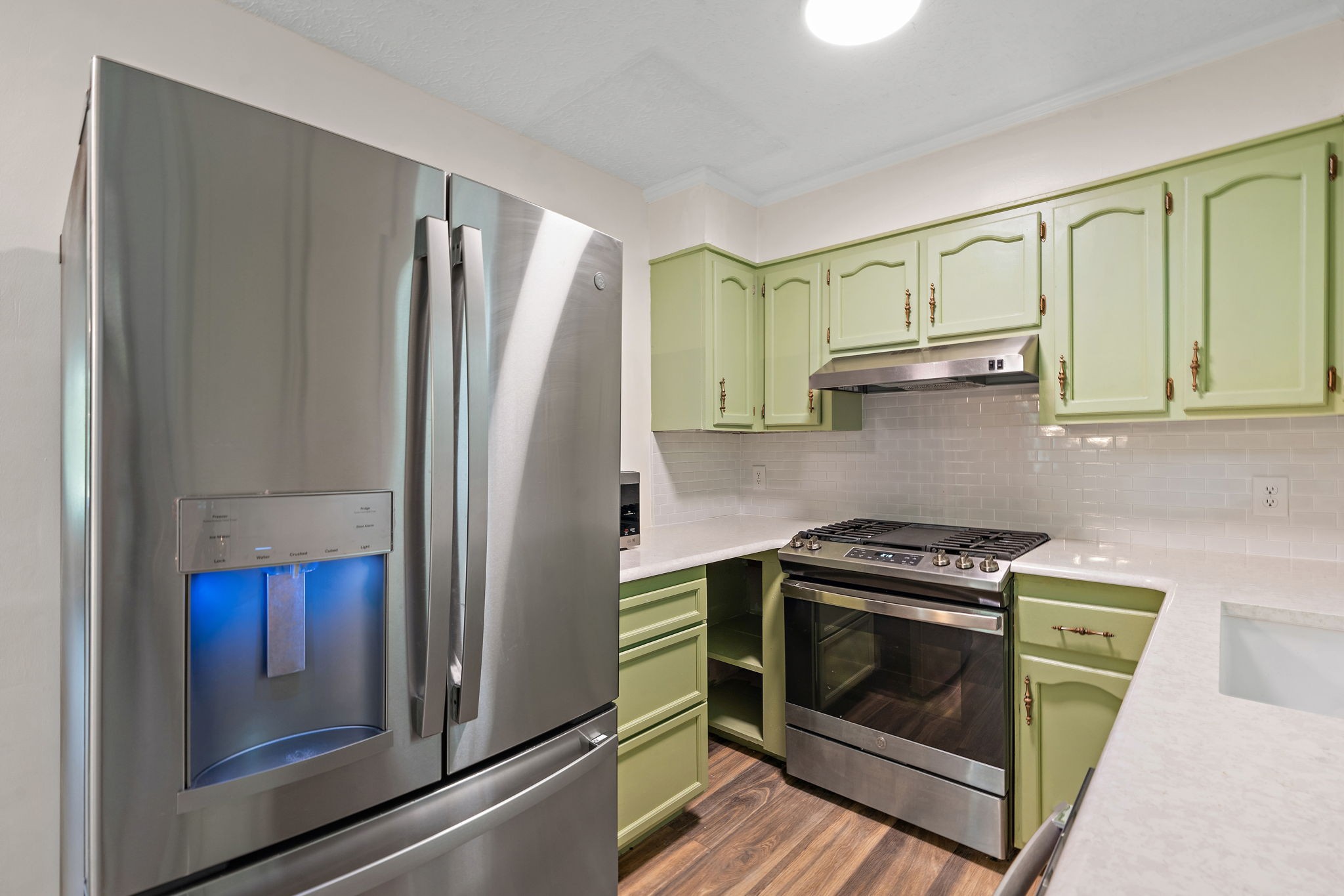 1627 West Grab Creek Road Dickson, TN 37055 - Photo 13 of 46 a kitchen with stainless steel appliances granite countertop a refrigerator and a stove