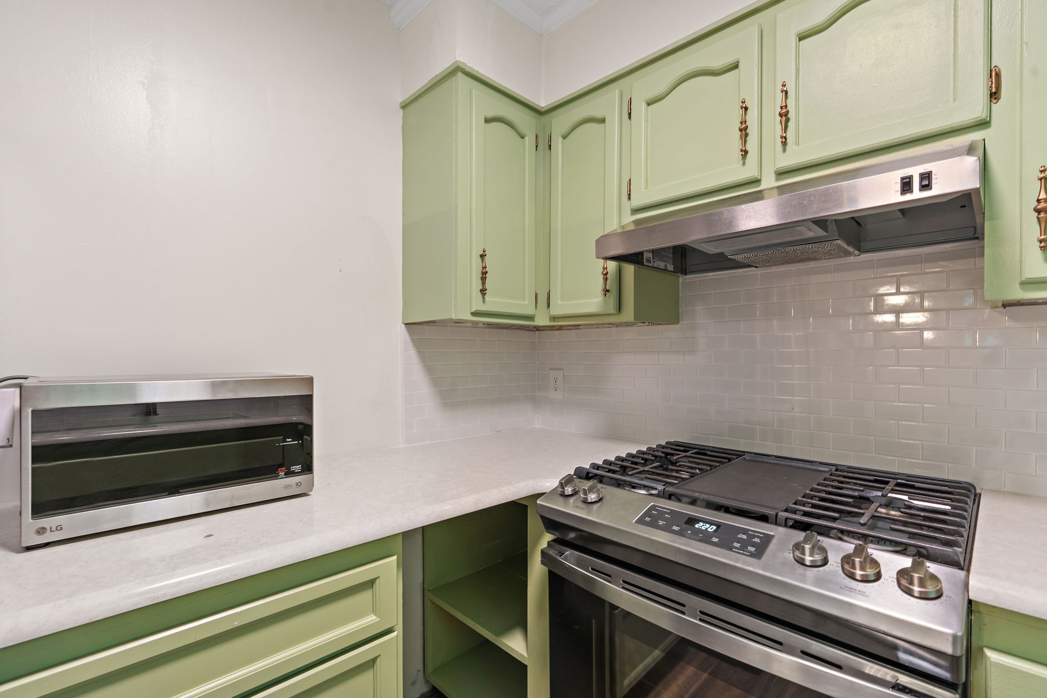 1627 West Grab Creek Road Dickson, TN 37055 - Photo 14 of 46 a stove top oven sitting inside of a kitchen