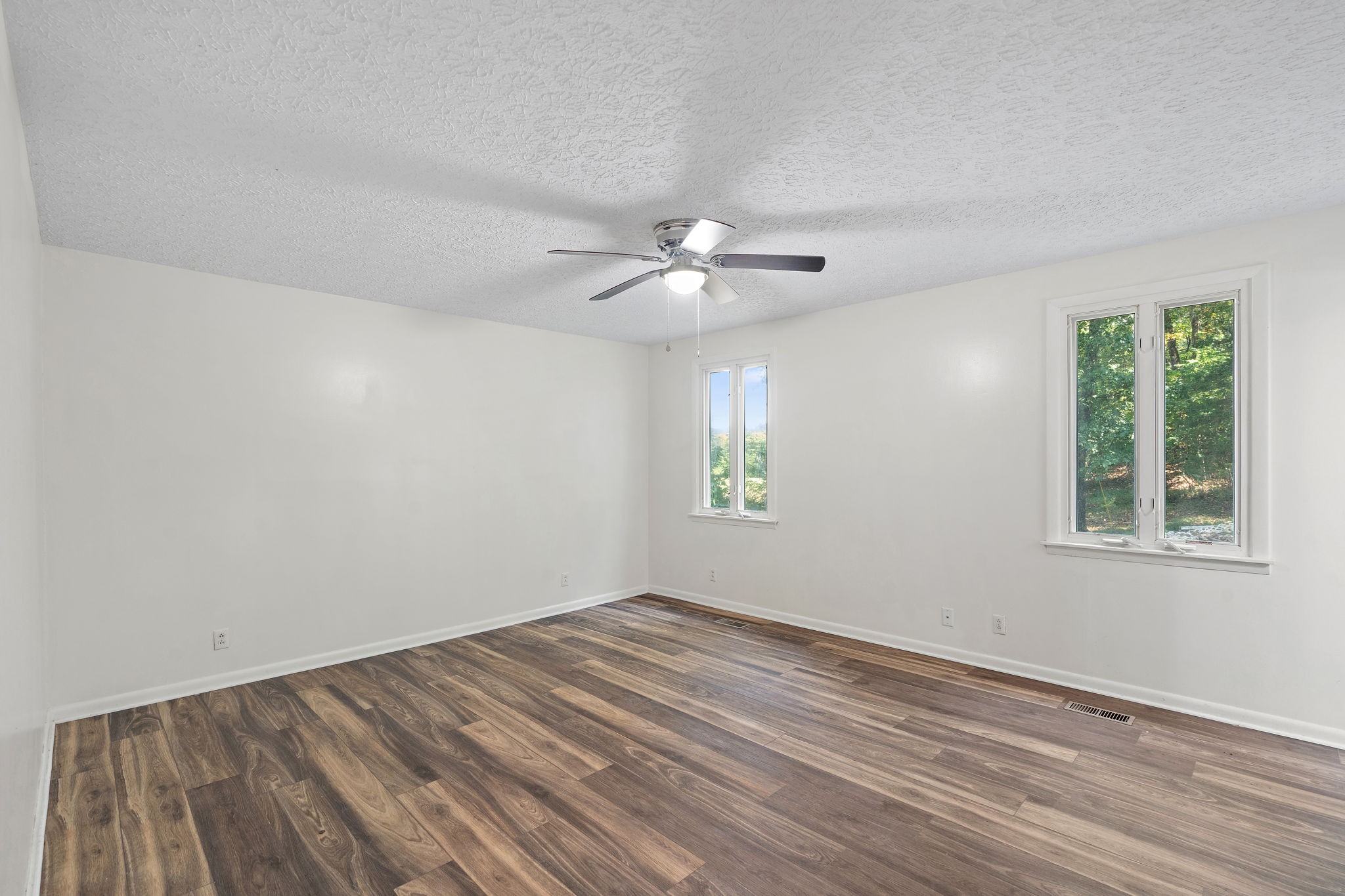 1627 West Grab Creek Road Dickson, TN 37055 - Photo 16 of 46 wooden floor in an empty room with a window