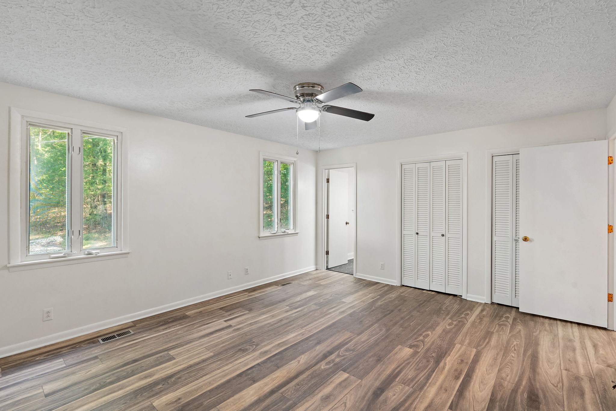 1627 West Grab Creek Road Dickson, TN 37055 - Photo 17 of 46 a view of empty room with wooden floor and fan