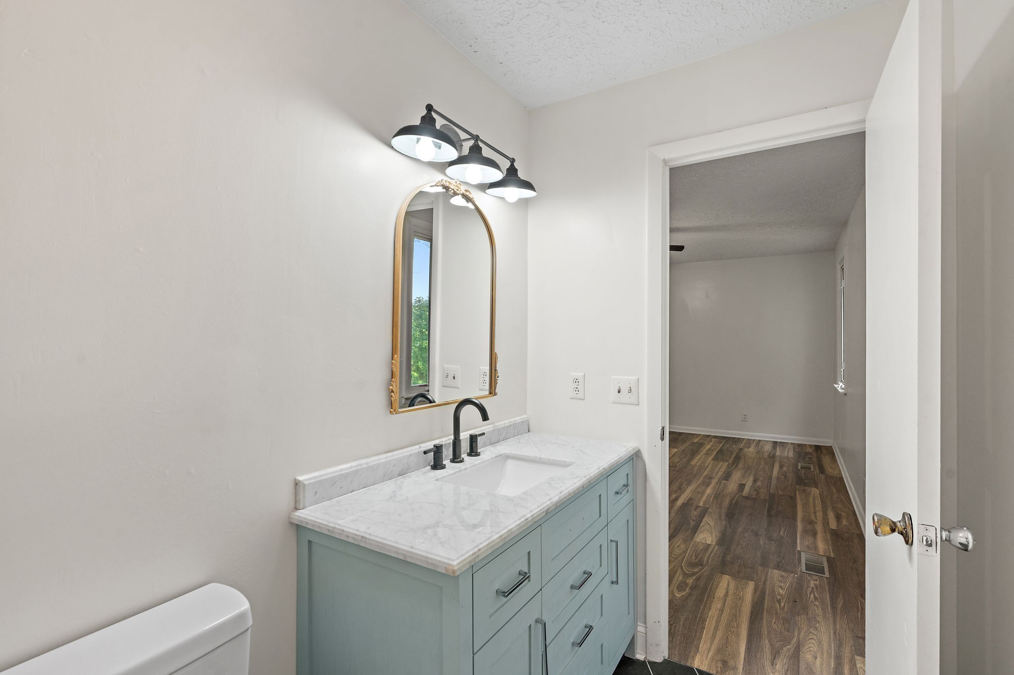 1627 West Grab Creek Road Dickson, TN 37055 - Photo 18 of 46 a bathroom with a sink a toilet and shower