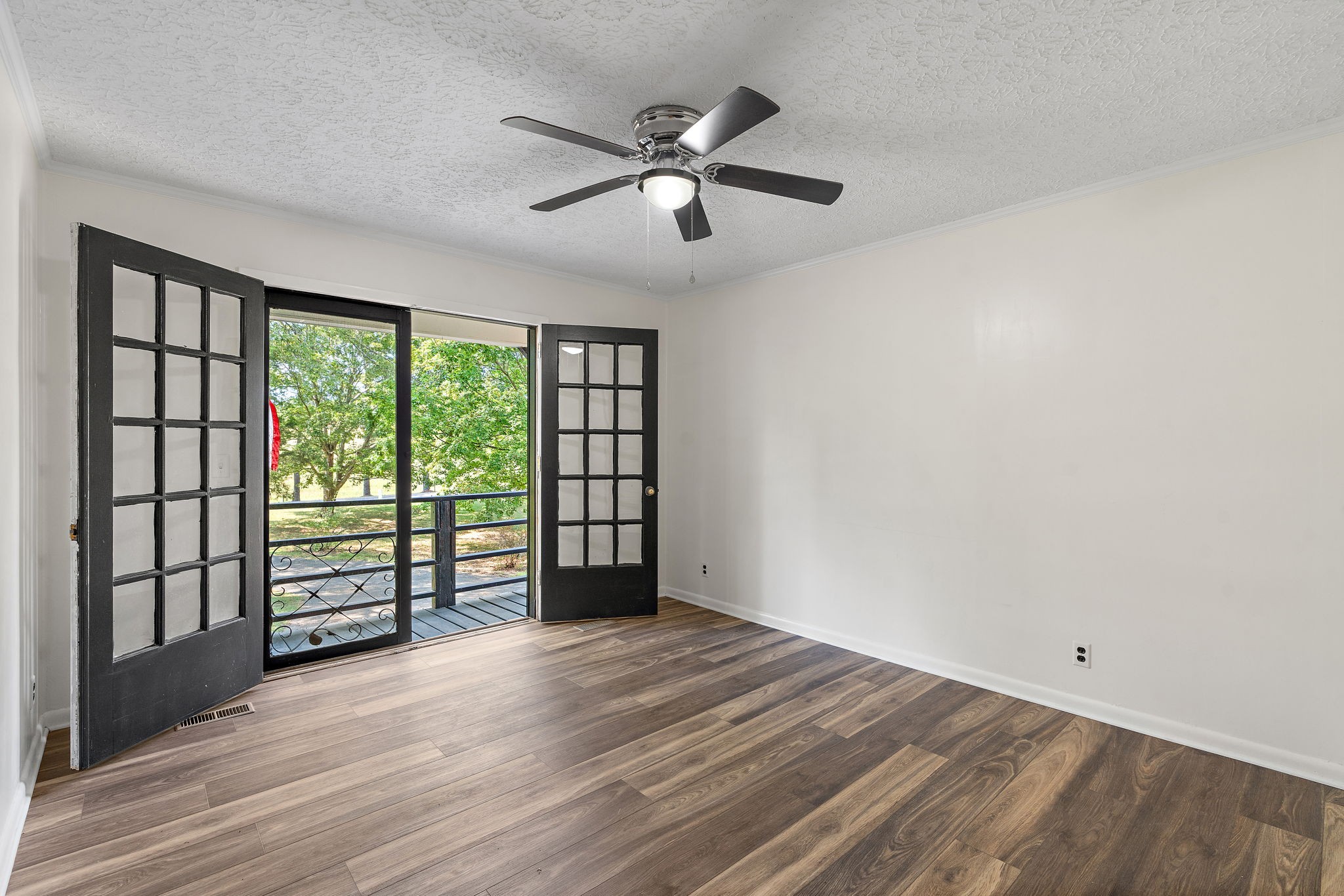 1627 West Grab Creek Road Dickson, TN 37055 - Photo 21 of 46 wooden floor in an empty room with a window