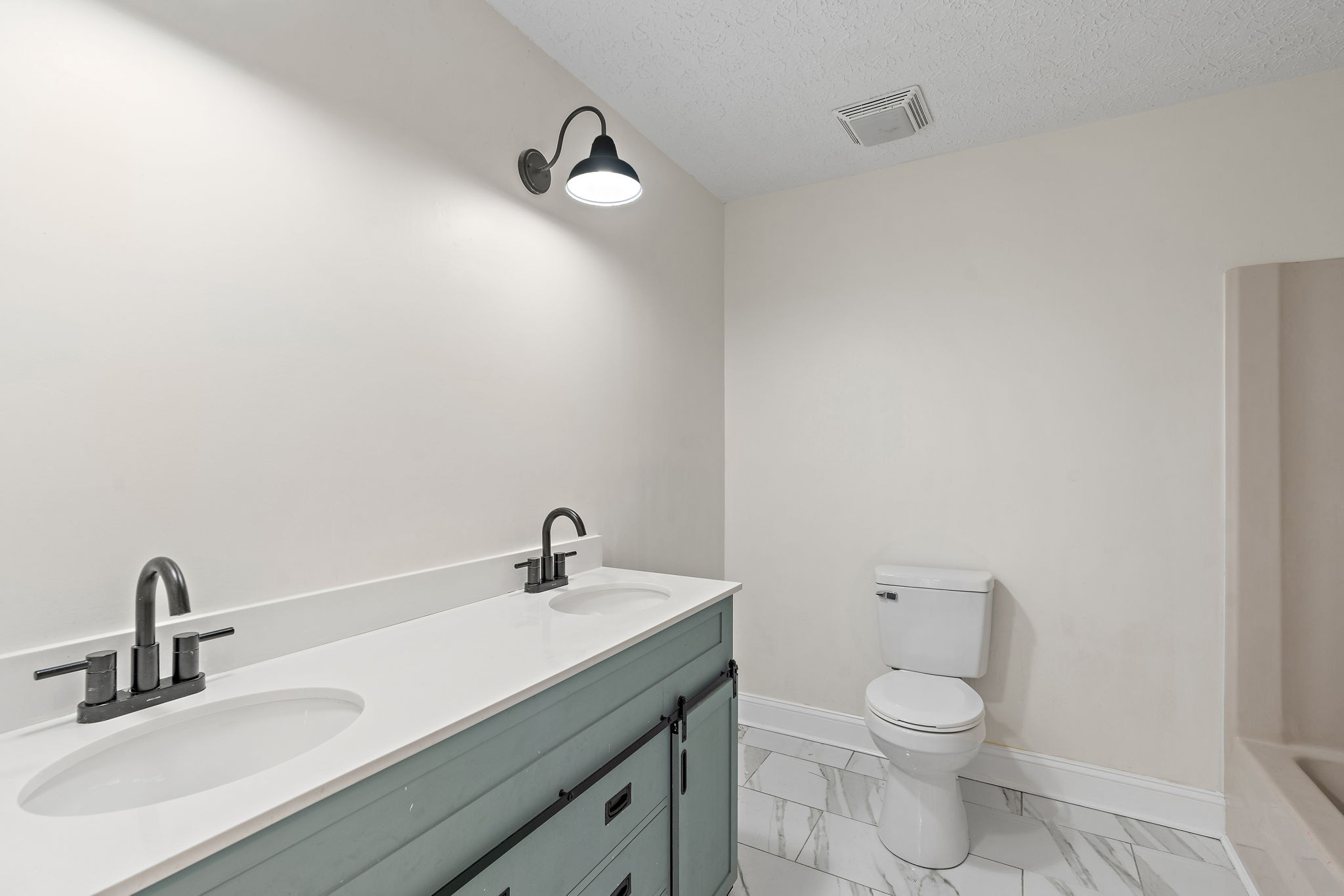 1627 West Grab Creek Road Dickson, TN 37055 - Photo 23 of 46 a bathroom with a sink a toilet and mirror