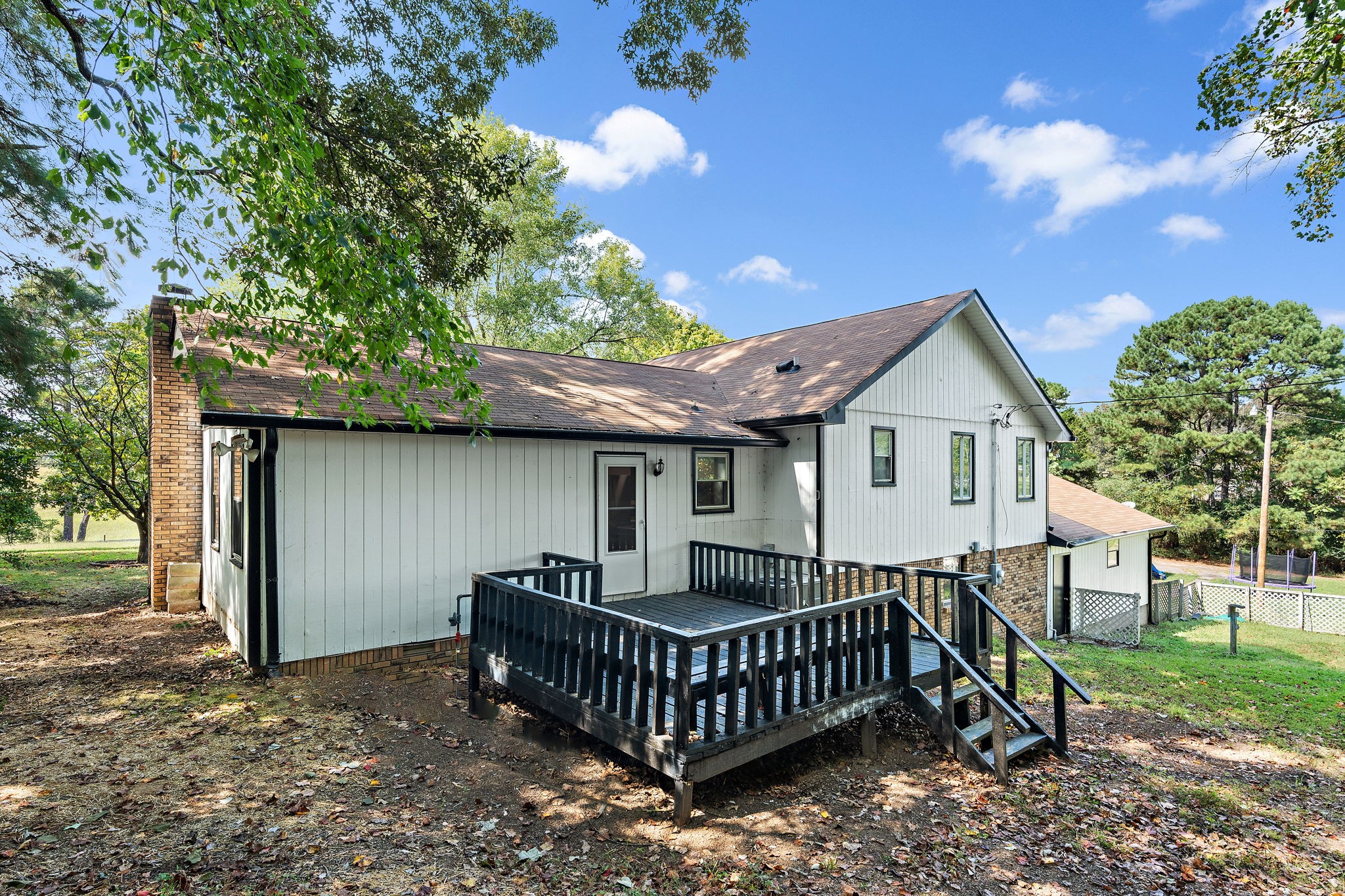 1627 West Grab Creek Road Dickson, TN 37055 - Photo 40 of 46 a front view of a house with garden and deck