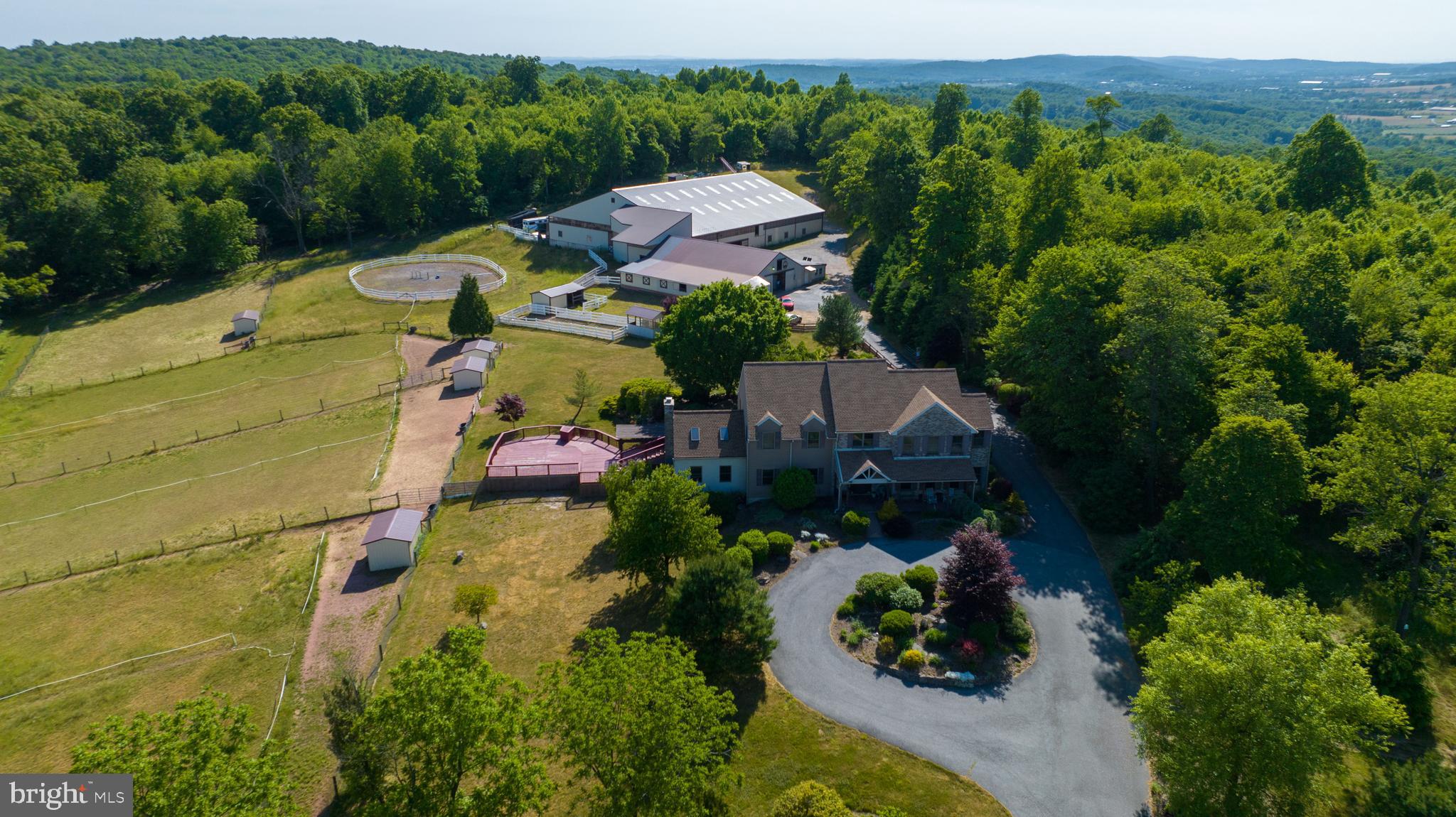 310 Mail Rte Road Sinking Spring, PA 19608 - Photo 2 of 42 an aerial view of a house with garden space and trees all around