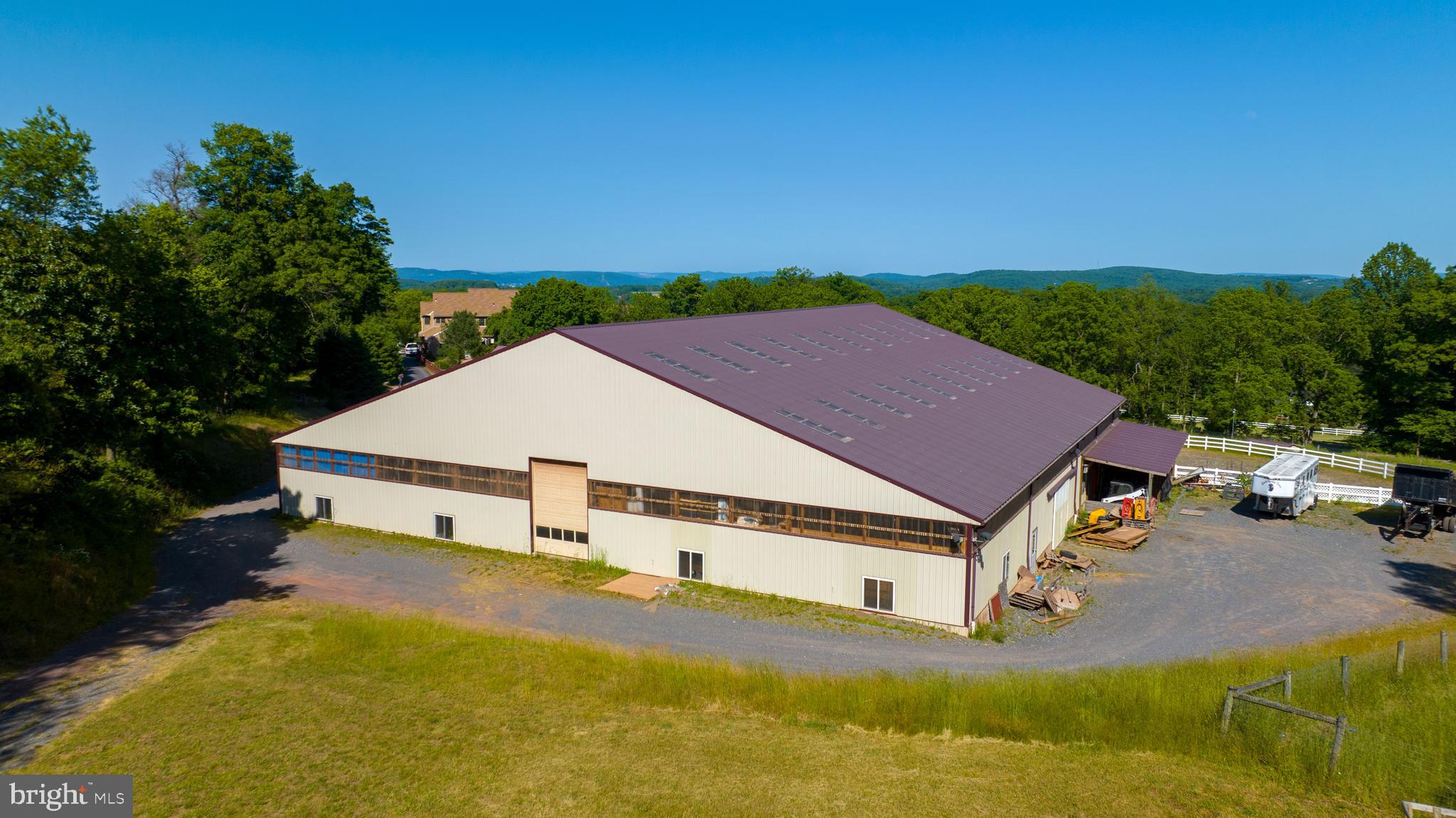 310 Mail Rte Road Sinking Spring, PA 19608 - Photo 4 of 42 a view of a white house with a big yard and large trees