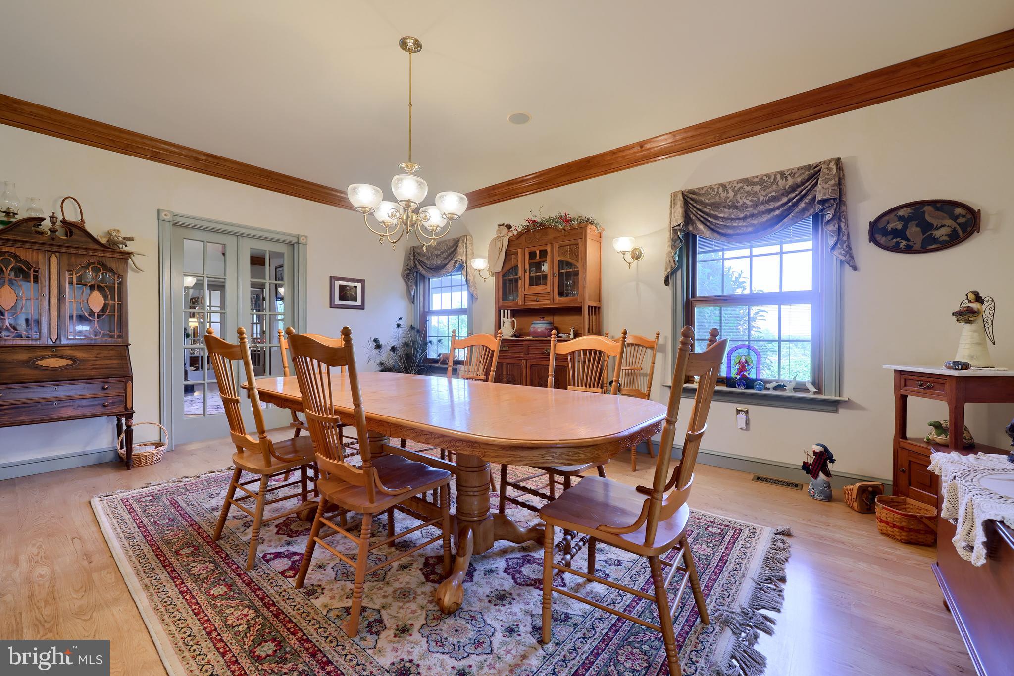 310 Mail Rte Road Sinking Spring, PA 19608 - Photo 9 of 42 a dining room with furniture a chandelier and wooden floor