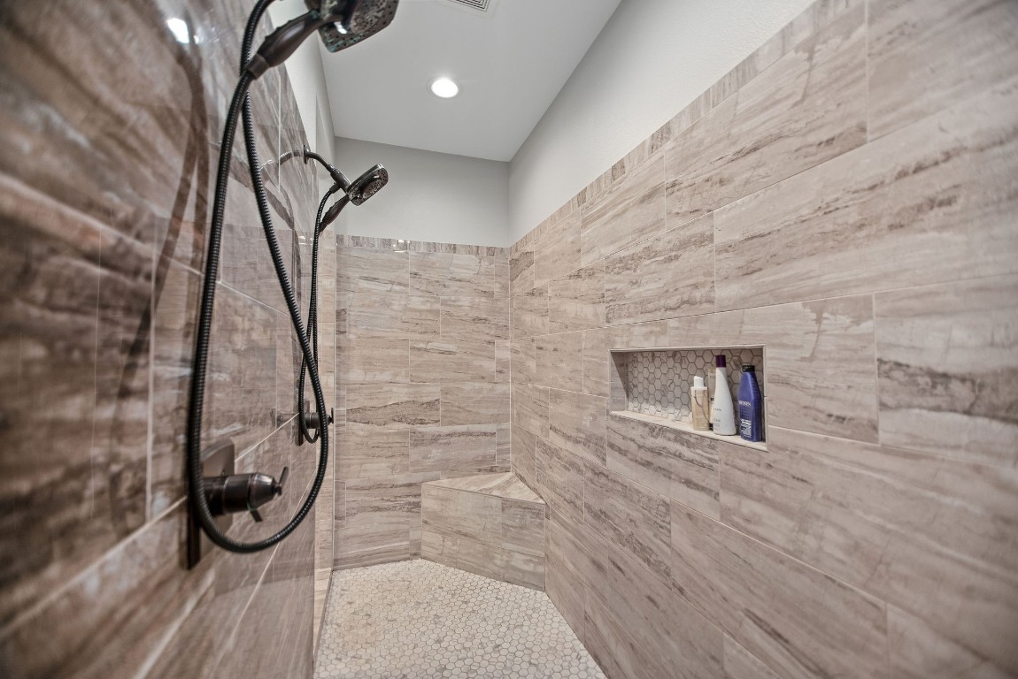 437 Bischoff Road Inez, TX 77968 - Photo 17 of 45 a bathroom with a granite countertop shower a mirror and toilet