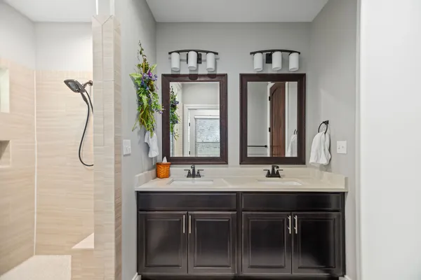 a bathroom with a glass shower door