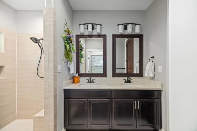 a bathroom with a glass shower door