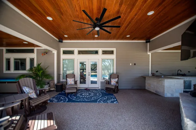 a living room with patio furniture