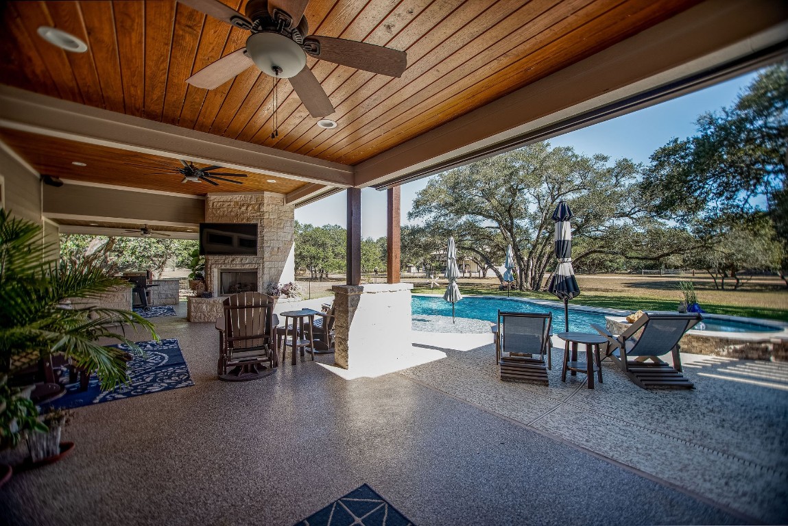 437 Bischoff Road Inez, TX 77968 - Photo 25 of 45 a view of a patio with table and chairs potted plants and floor to ceiling window